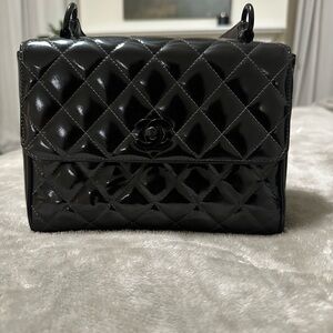 AUTHENTIC Vintage Chanel Kelly Bag. Black on black patent Leather.
